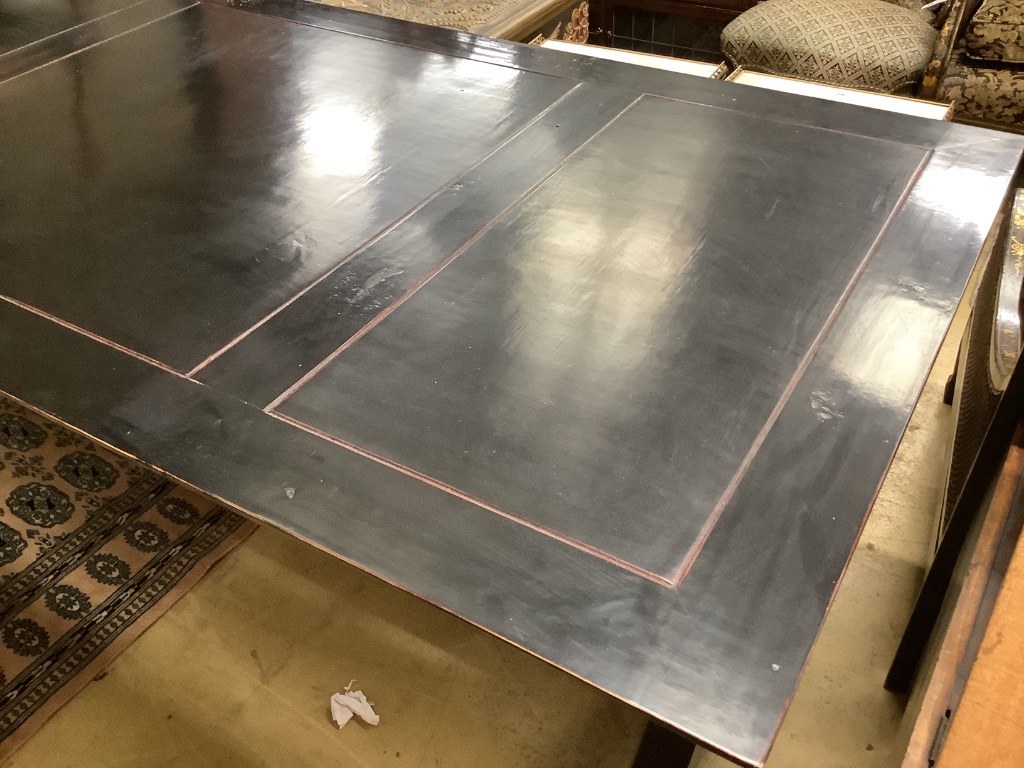 A contemporary ebonised dining table, width 200cm depth 100cm height 77cm